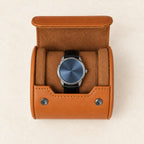 Top view of the open single watch roll with a watch on its pillow