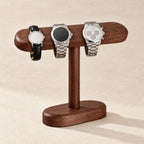 Walnut T-bar stand with watches of different sizes