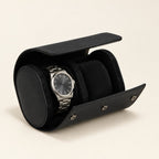 Black travel watch roll open with a watch