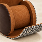 Close-up of the tan lining, the pillow and a snap stud on the houndstooth flap