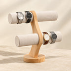 Two-tier curved wooden watch stand with four watches, three-quarter view