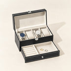 Two-tier 4-slot watch and jewelry box in black faux leather with the lid open