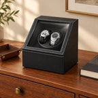 Double watch winder on a wooden chest of drawers
