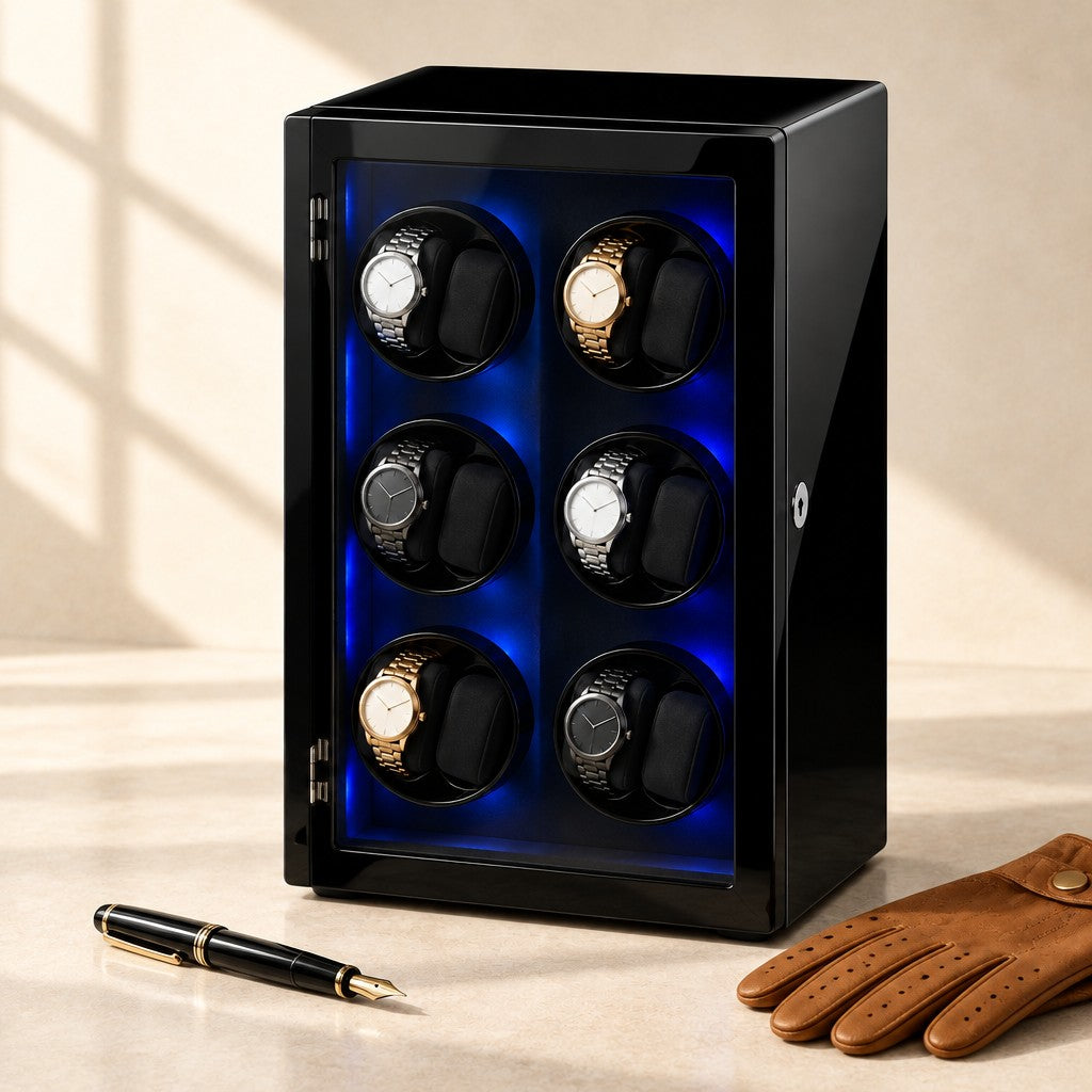 Black winder cabinet closed, beside a fountain pen and leather gloves