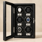 Front view of the six cups, each with its two knobs, and watches of different sizes