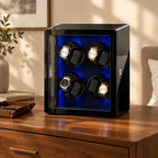 8-watch winder cabinet on a wooden chest of drawers beside a valet tray and a book