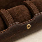 Close-up of the soft lining, a padded pillow and a brass-tone snap stud