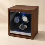 Walnut 3-watch winder with three watches behind its glass door