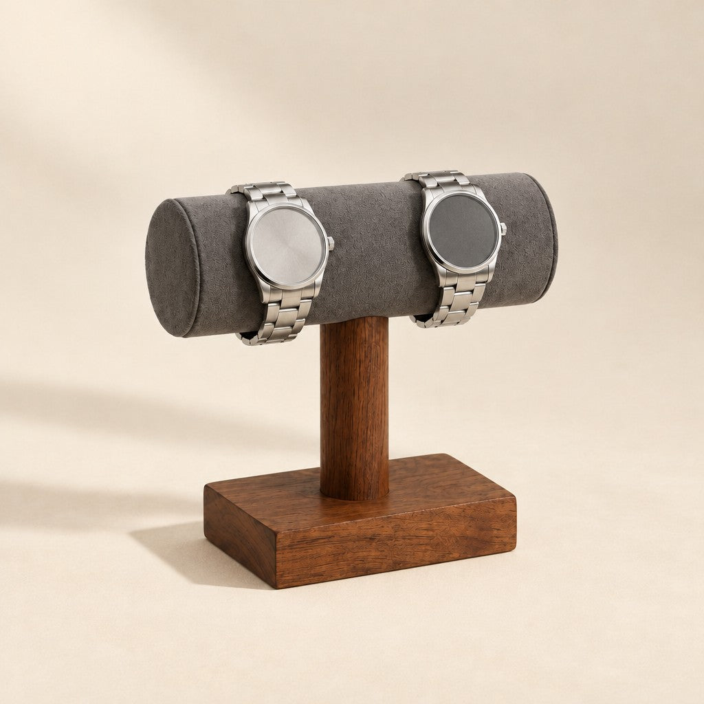 Short walnut T-bar stand with a grey velvet bar holding two watches