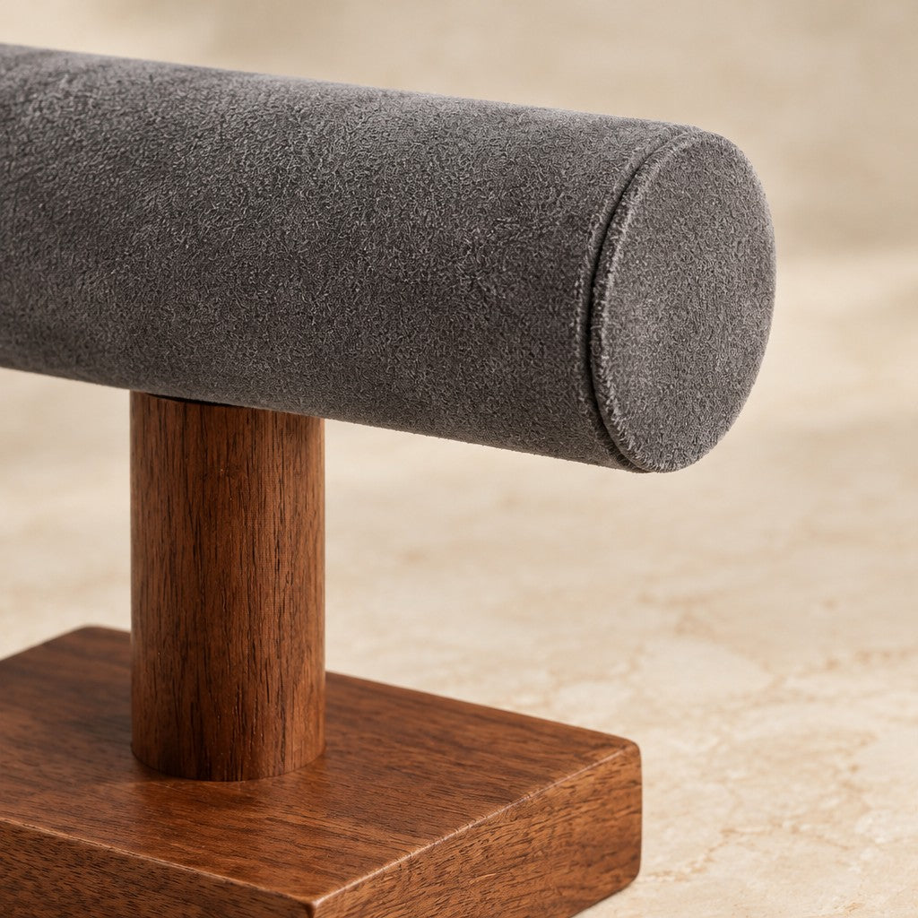 Close-up of the grey microfiber velvet bar and the walnut post