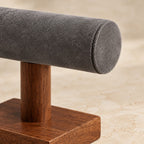 Close-up of the grey microfiber velvet bar and the walnut post