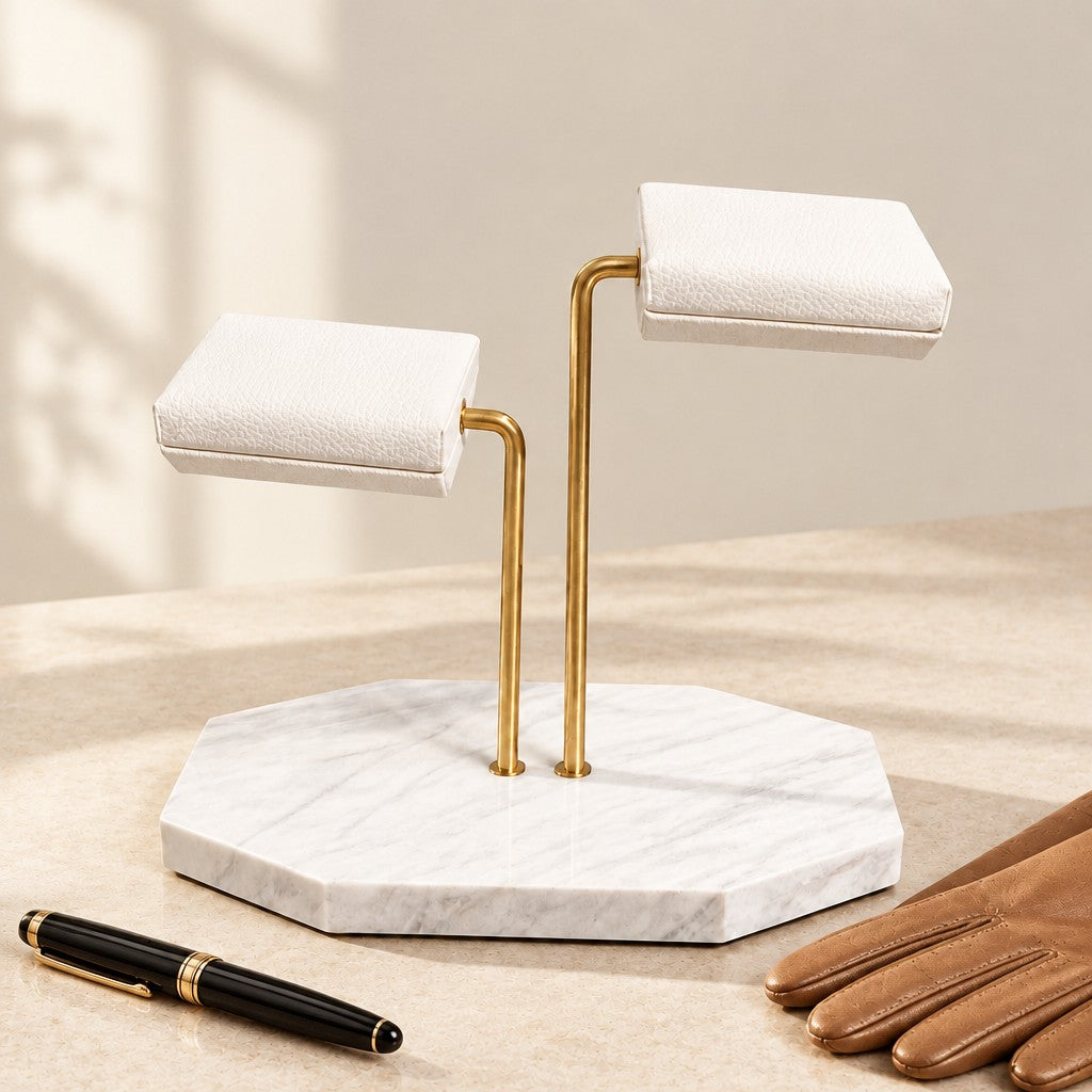 White Marble Two-Tier Double Watch Stand beside a fountain pen and leather gloves