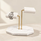 White marble two-tier watch stand with white pillows