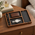 Wooden nightstand valet tray with felt-lined compartments, on a chest of drawers, for scale