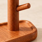 Wooden valet tray with a watch and key stand, close-up of the materials and finish