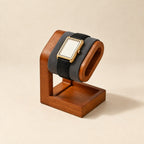 Single wooden watch stand with a gray pillow