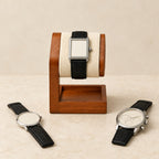 Wooden pillow stand holding a 42 mm watch, with a 36 mm and a 45 mm watch beside it