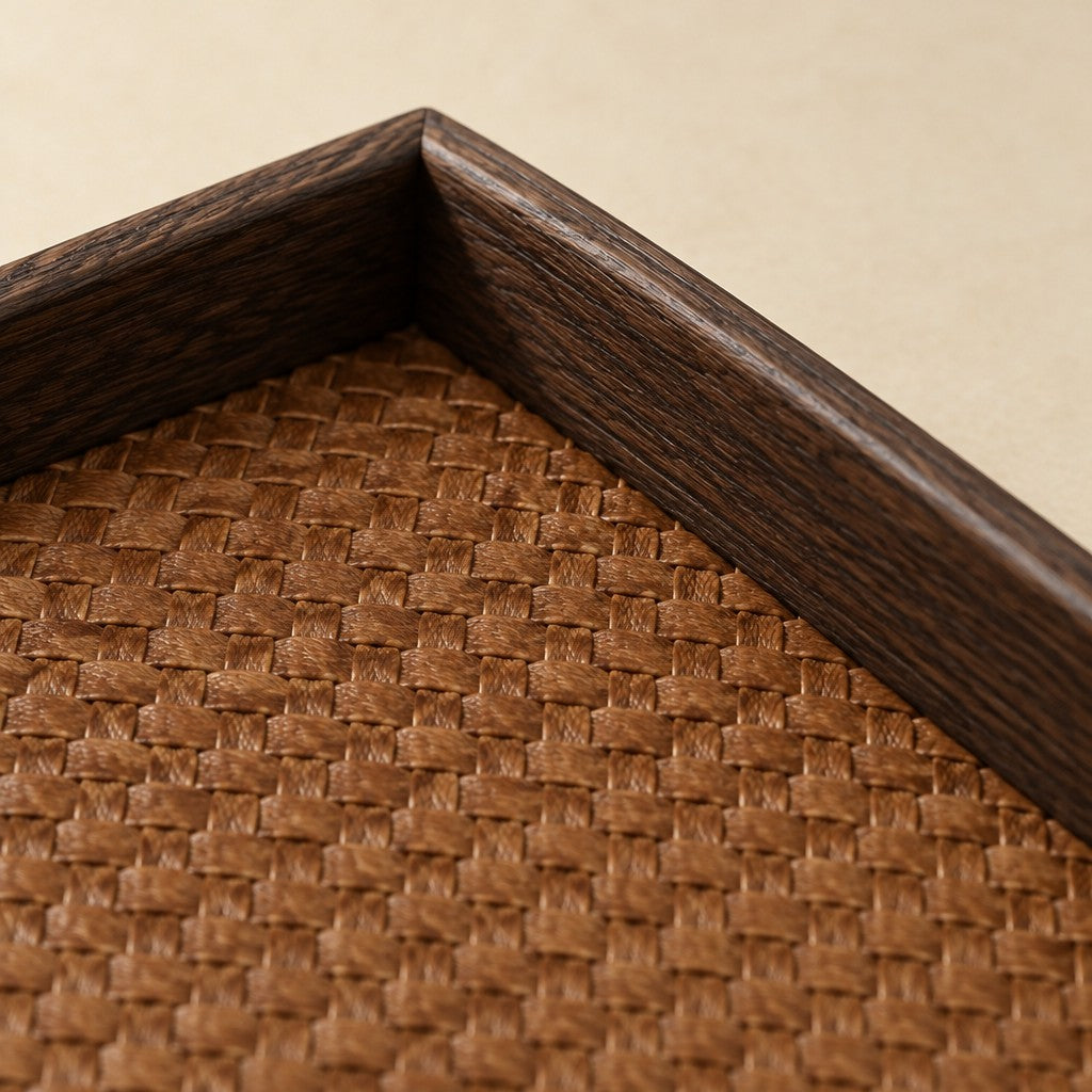 Woven valet tray with a dark wood-grain frame, close-up of the materials and finish