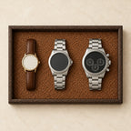 Woven valet tray with a dark wood-grain frame, from above, with watches of different sizes